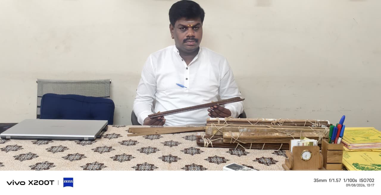 Bundles of ancient Naadi palm leaves on the reading table