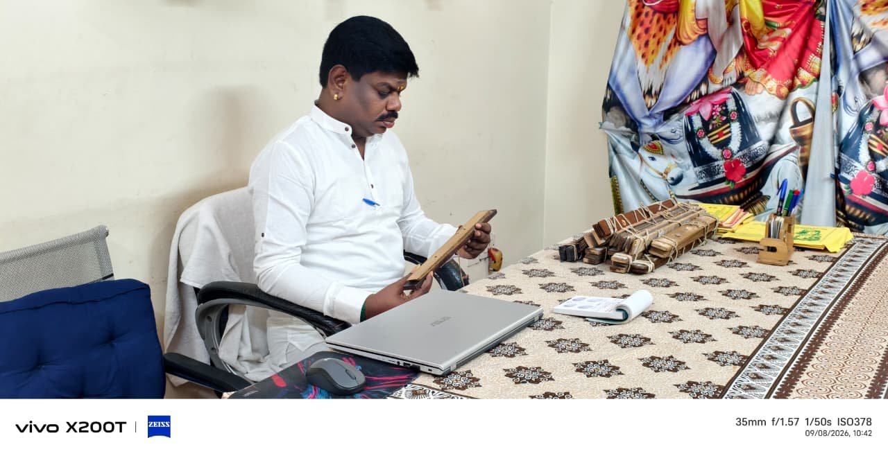 Guruji reading a palm leaf