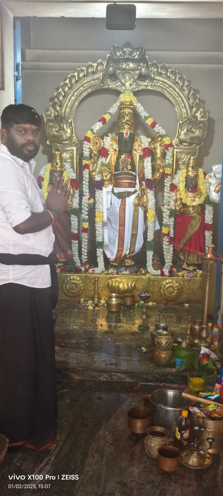 Guruji offering prayers at a temple